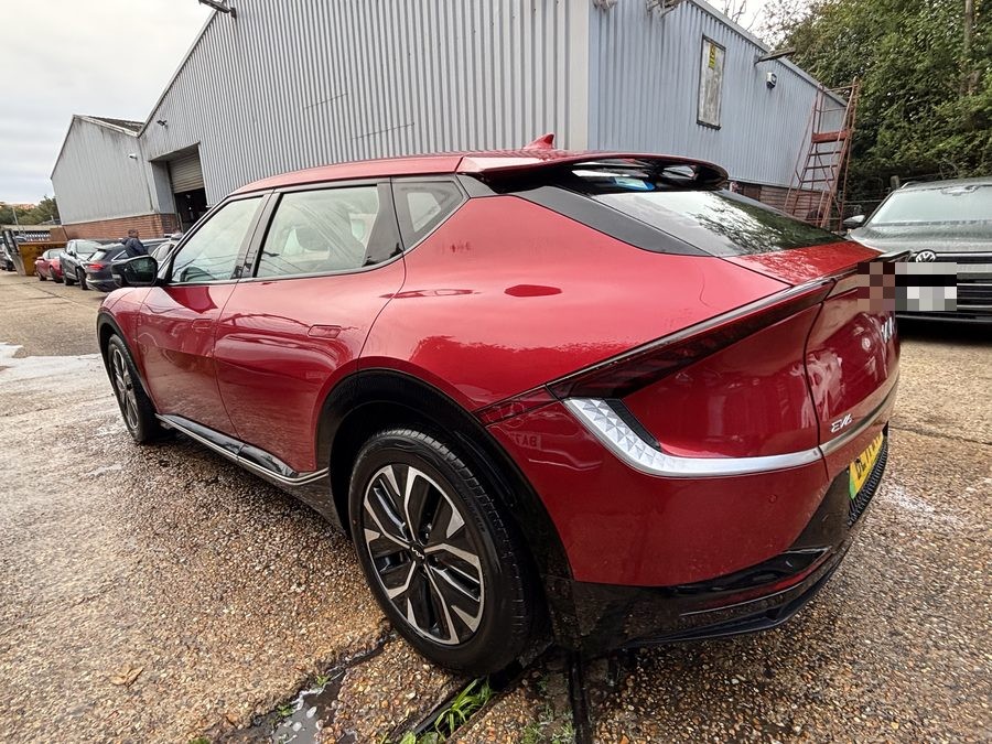 Red Kia EV4 Fastback after accident repair at Crowborough Accident Repair Services