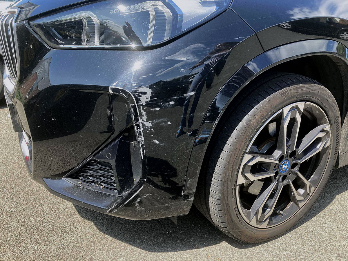 BMW front bumper and headlight damage before accident repair
