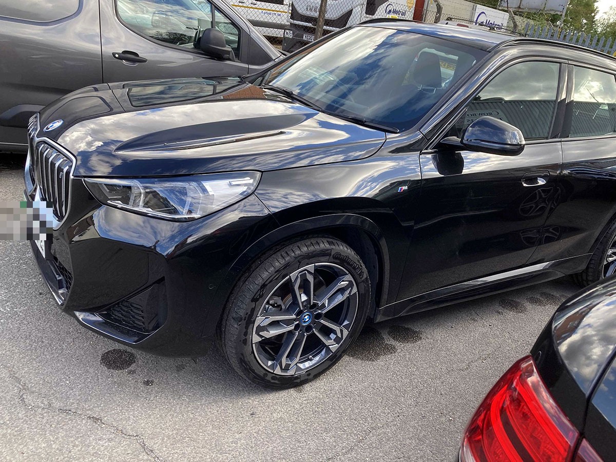 BMW front bumper and headlight after completed accident repair